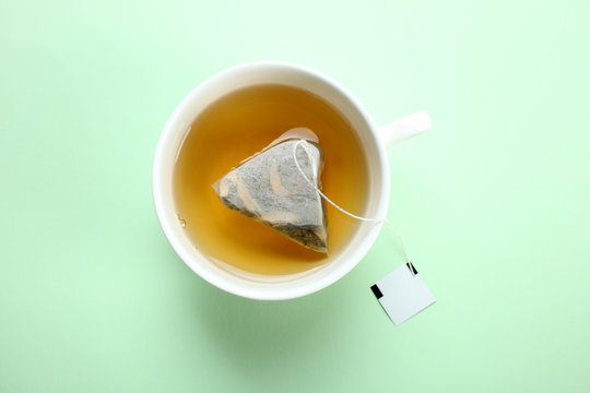 Fototapeta Mint tea bag in a cup