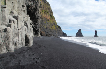 Cave and rocks on the coast in Iceland