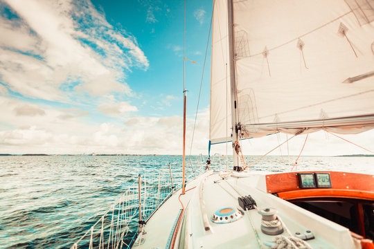 Fototapeta Yachting on sail boat during sunny weather