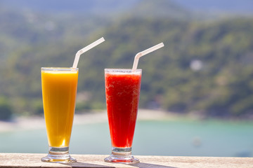 Two fresh organic shake from mango and watermelon in thai restaurant on the beach near sea , Thailand. Close up