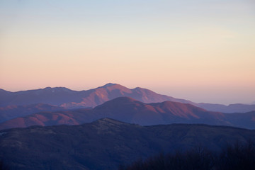 ridges of mountains in a beautiful winter sunset