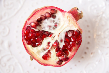 half of  pomegranate.white background.top view