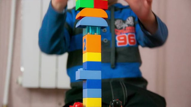 Boy blay with a constructor