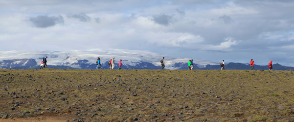 Tourists hike in Iceland