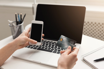 Unrecognizable woman at home shopping online