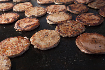 Frying hamburger meat. Hotel and restaurant food. Unhealthy food