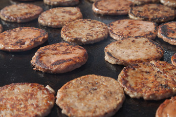 Frying hamburger meat. Hotel and restaurant food. Unhealthy food