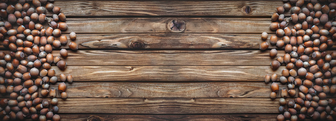 Hazelnut on a wooden background. Useful autumn food. Snacks. Copy space.