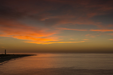 Fototapeta na wymiar Sunrise over the Atlantic off the coast of Fuerteventura with small waves