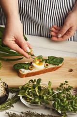 Feamale hands making healthy bruschettas for right snack