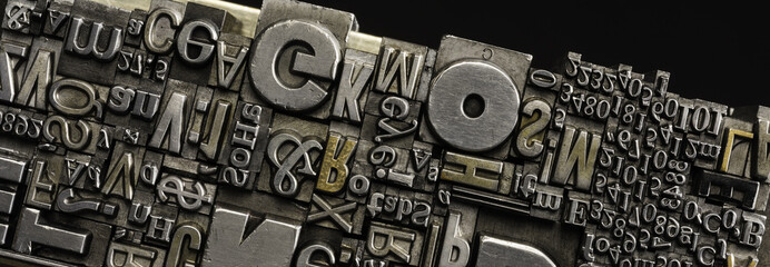 Metal Letterpress Types.
A background from many historical typography letters in black and white with white background.

