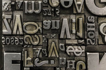 Metal Letterpress Types.
A background from many historical typography letters in black and white with white background.
