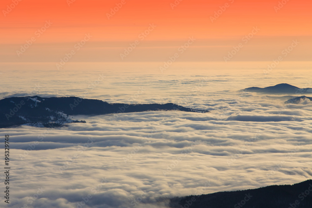 Poster beautiful sunset or sunrise above the clouds. Romania