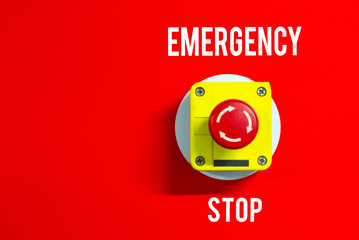 Emergency button on red background,