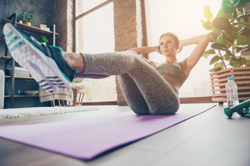 Low-angle photo of attractive sportive pretty strong muscular flexible woman doing sit-ups and...