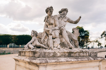 Fototapeta na wymiar Obelisk, sculpture and the garden of the Tuileries in Paris