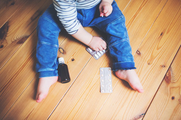 Toddler boy in a dangerous situation at home.