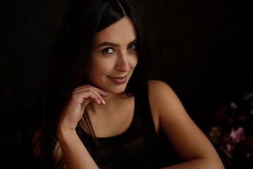 Fototapeta premium Beauty portrait of young adorable fresh looking brunette woman with long brown healthy curly hair.