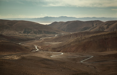 A sinuous road wriggling through a nice mountain scenery in Argentina