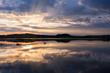 Fototapeta premium Beautiful summer sunset on the river. 