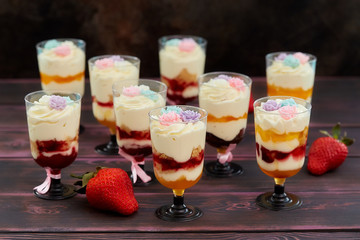 Cake with strawberry served in glass shots