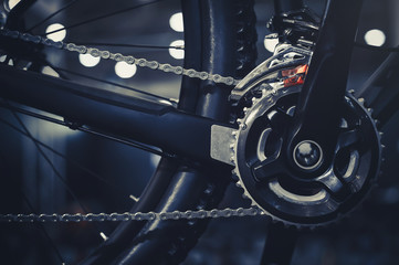 Closeup of a mechanism of bicycle mechanisms and chain on a mountain bike. Pedals from a mountain...
