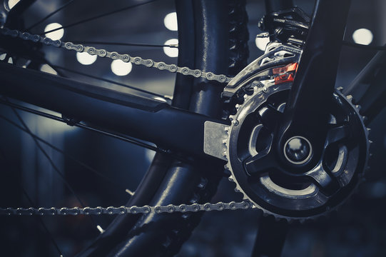 Closeup of a mechanism of bicycle mechanisms and chain on a mountain bike. Pedals from a mountain bike. Close the detailed view