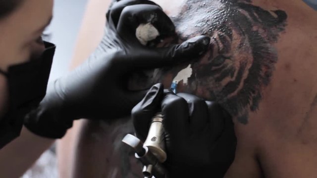 master stuffs a tattoo