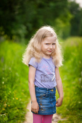 Cute girl in summer field