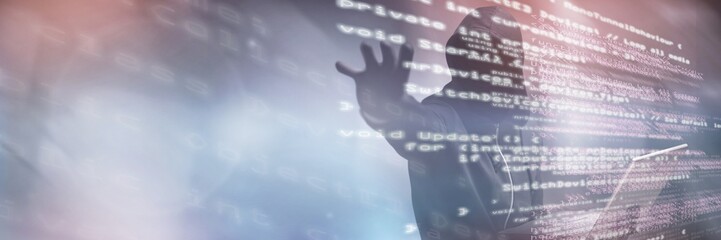 Composite image of hacker holding laptop while gesturing