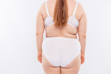 Rear view of midsection of young woman in underwear - Powered by Adobe