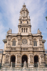 Fototapeta na wymiar Clock tower of Sainte trinite, roman catholic church in Paris, France
