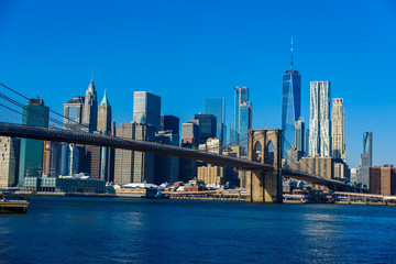Fototapeta na wymiar Lower Manhattan Downtown skyline panorama from Brooklyn Bridge Park riverbank, New York City, USA