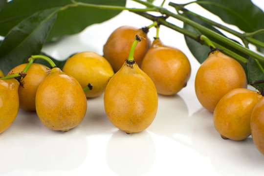 Bolivian exotic fruit called Achachairu in white background