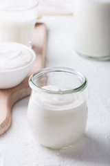 Organic sour cream in in glass jar
