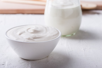 Organic sour cream in white bowl