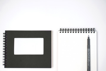 Fototapeta na wymiar notebook and pen on White background