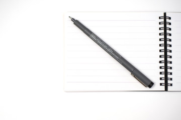 notebook and pen on White background