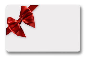 Greeting card with red satin ribbon and bow, isolated on white background 