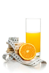 Centimeter, orange, orange juice in a glass, crispbreads. Diet, fitness, sports nutrition. Isolate on white background