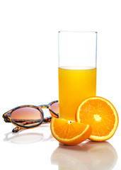 Sunglasses, orange, orange juice in a glass. Isolate on white background