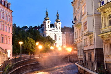 Fototapeta na wymiar Church of St Mary Magdalene and Hot Springs Church Square Karlovy Vary Czech Republic