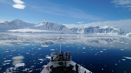 Cruising through the Neumayer channel full of Icebergs in Antarctica. - obrazy, fototapety, plakaty