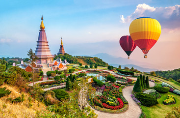 Colorful hot-air balloons flying over the doi Inthanon national park with sunset at Chiang mai, Thailand. - obrazy, fototapety, plakaty