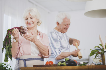 Seniors preparing healthy meal together