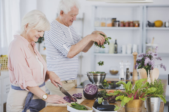 Elderly preparing healthy meal together