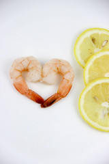 seafood. shrimp on a plate with lemon.