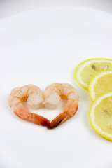 seafood. shrimp on a plate with lemon.