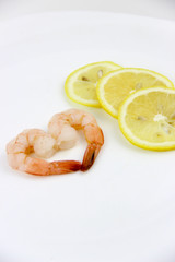 seafood. shrimp on a plate with lemon.