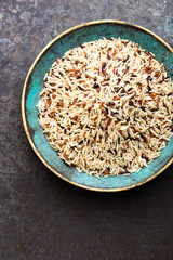 White, brown and black wild rice. Rice in bowl.